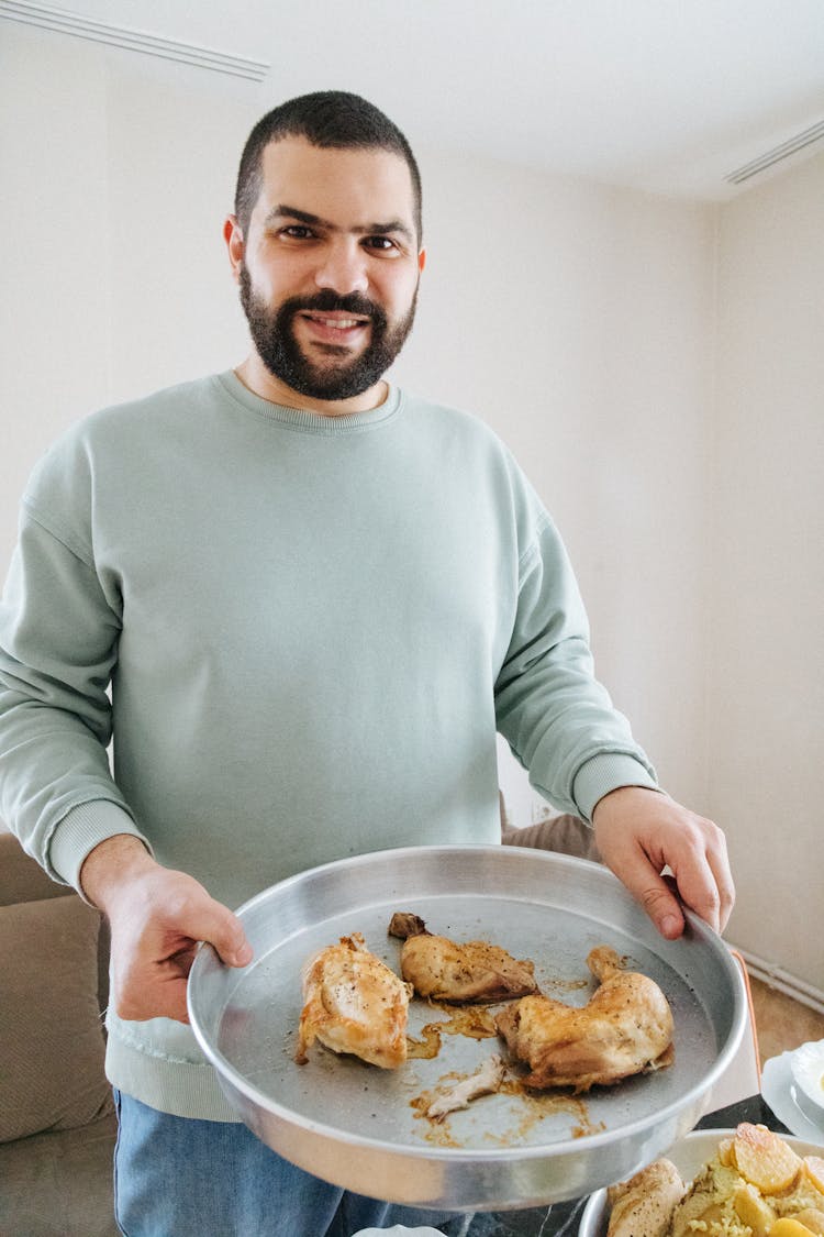 Man With Pan Of Fried Chicken