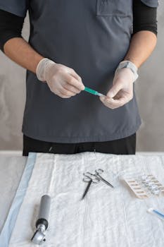 A healthcare professional preparing a syringe in a clinical environment, highlighting medical precision.