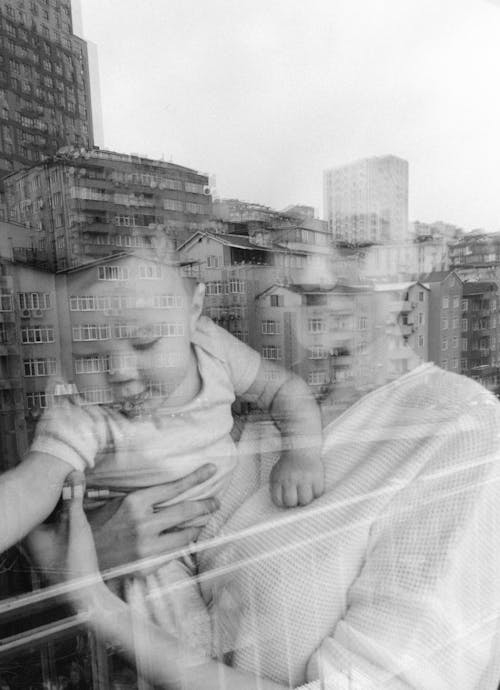 Free Grayscale Photo of Baby on White Textile Stock Photo
