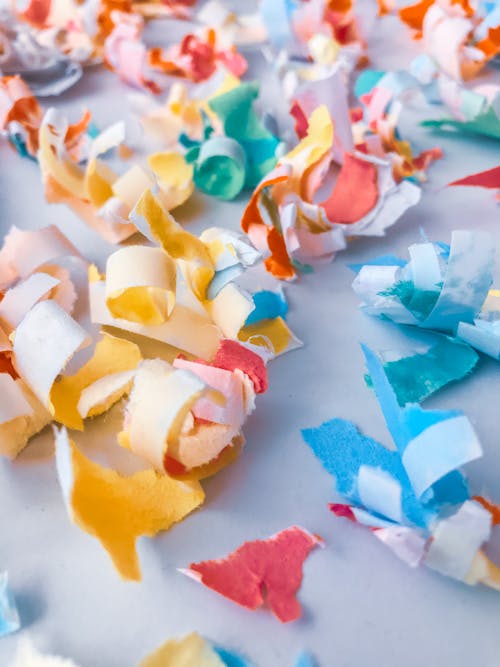 Scraps of colored paper on table