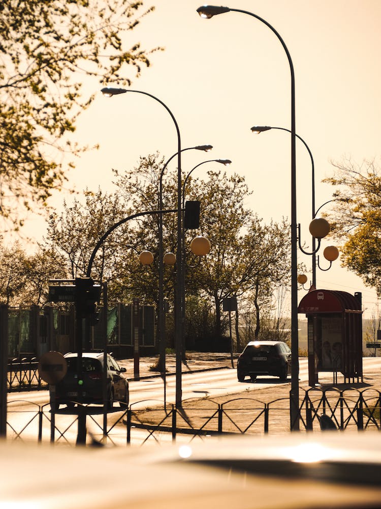 Cars On The Street In City In Summer 