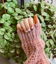 Person Wearing Pink Knit Gloves Holding Green Leaves