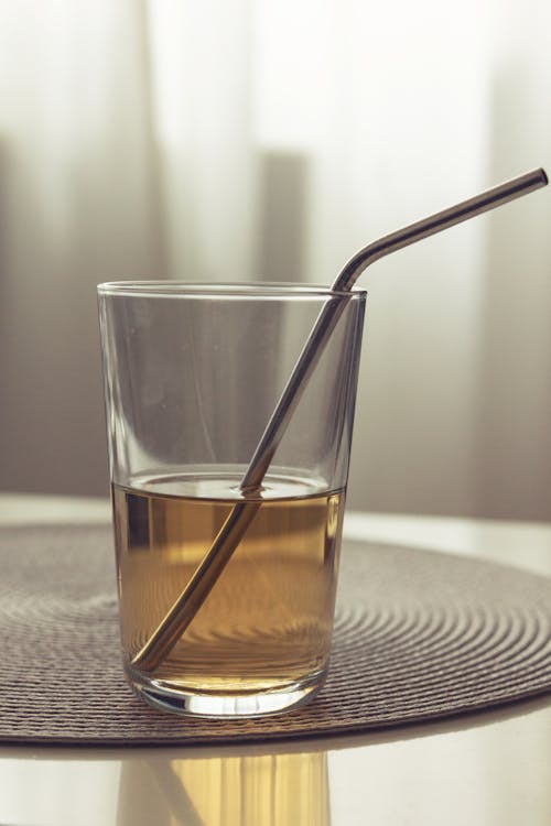 Photograph of a Glass with Yellow Liquid