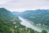 Aerial Photography of Green Mountains and River under the Sky