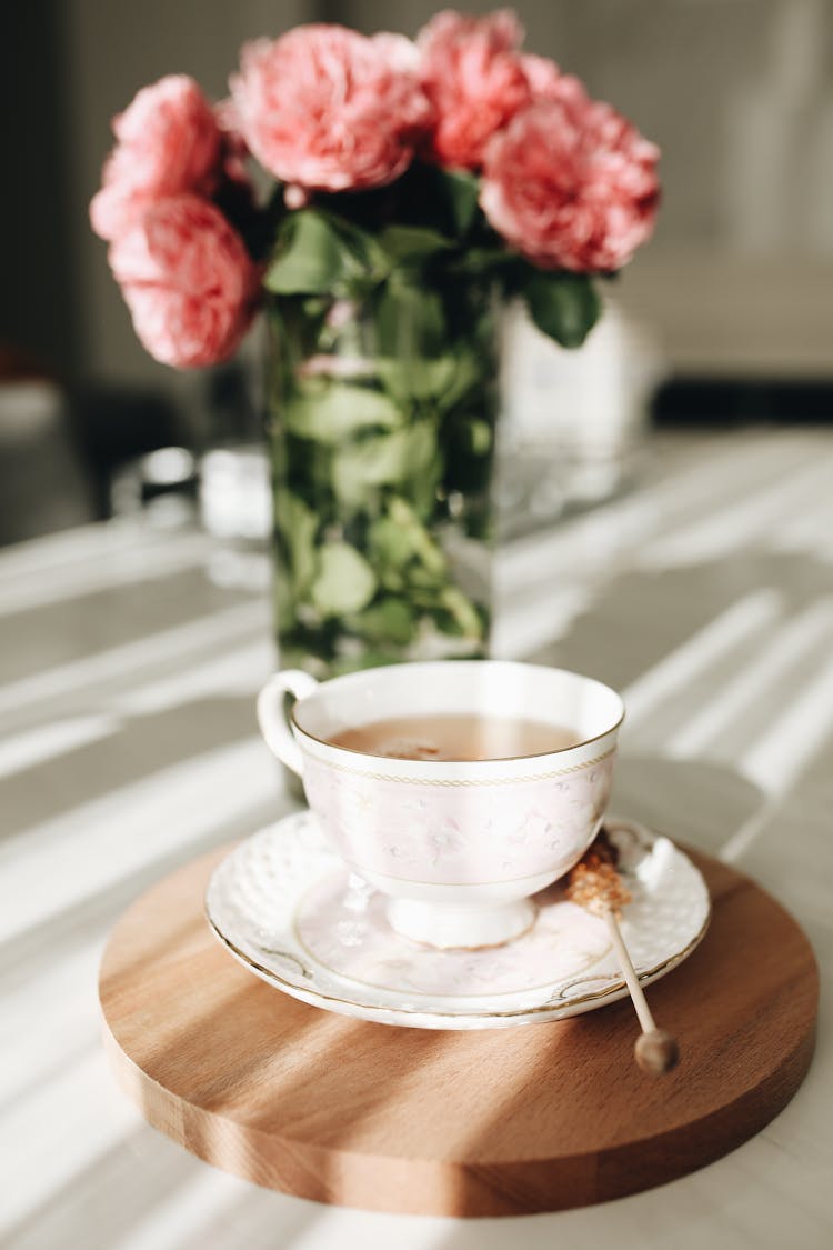 Roses On Table Near Tea