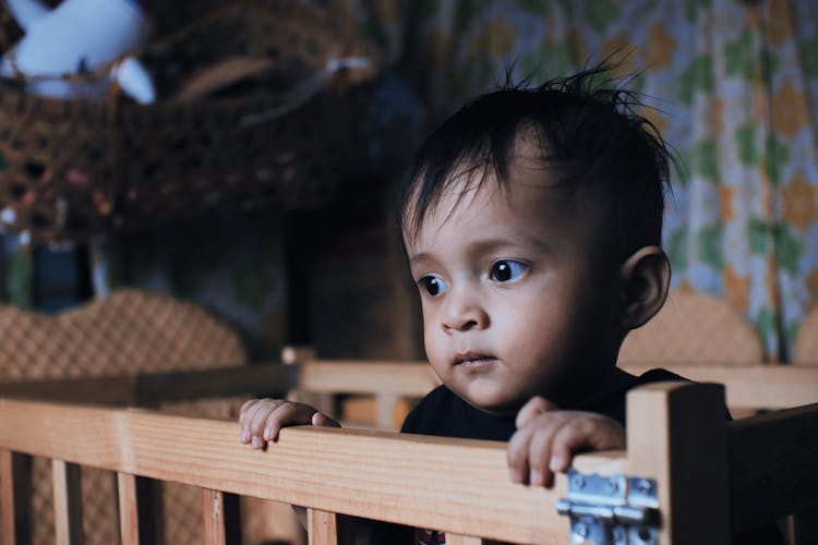 Cute Baby In Cradle At Home