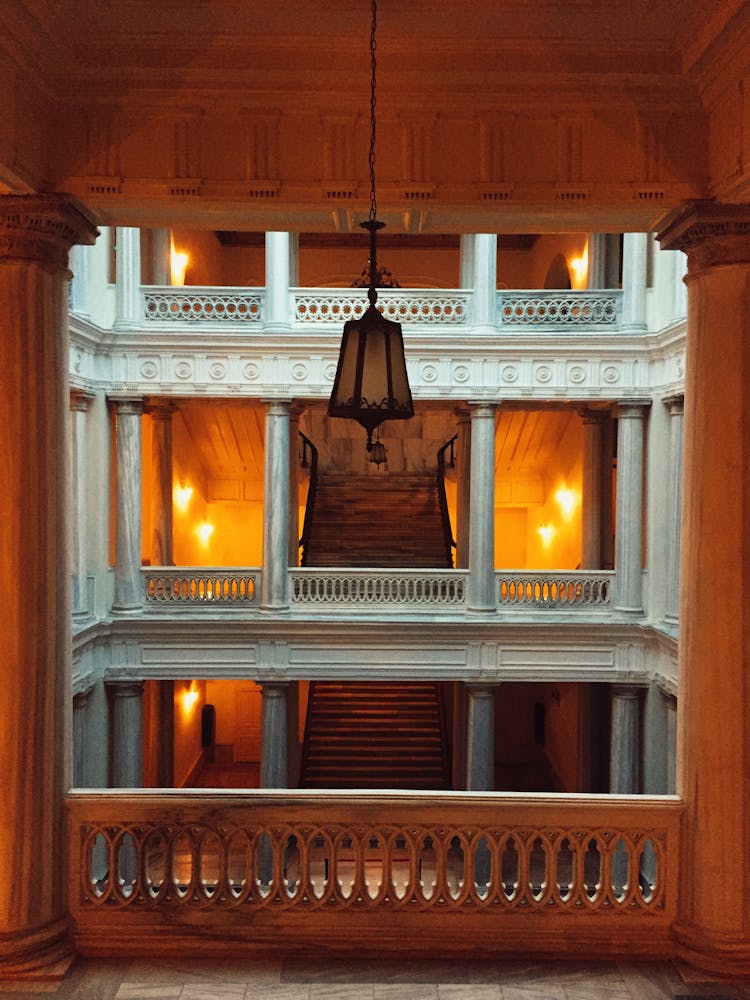 Symmetrical View Of An Interior Of A Castle Staircase 