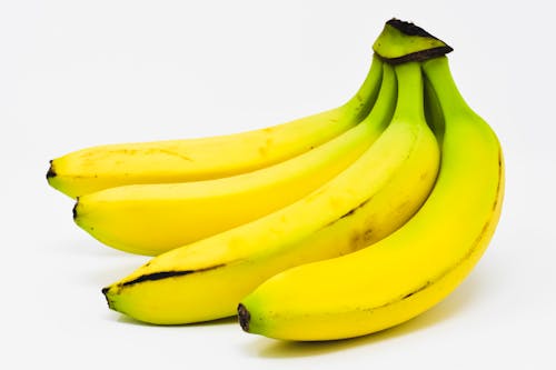 Free Yellow Bananas on White Background Stock Photo