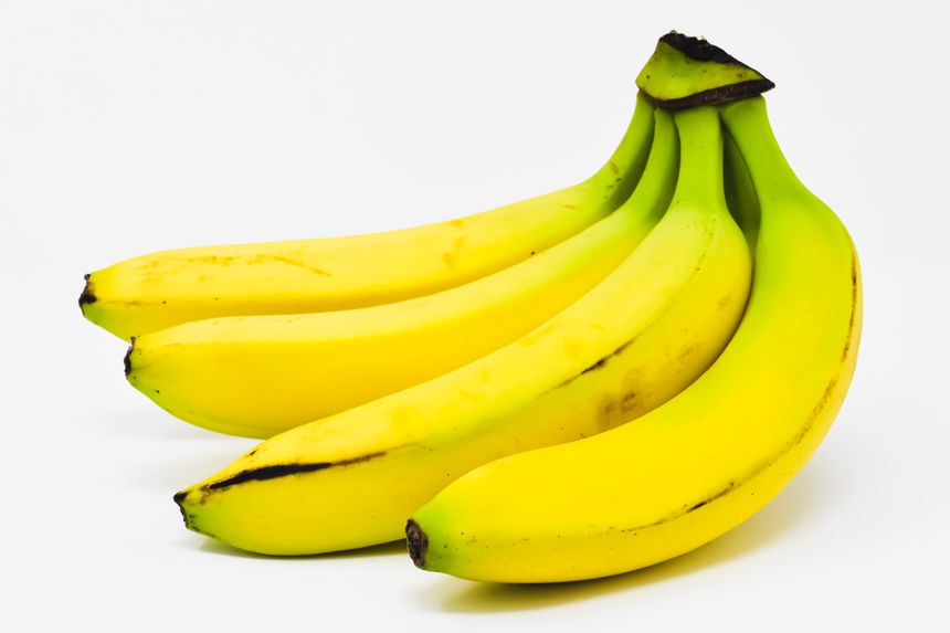 Cluster of ripe yellow bananas on a white studio backdrop — photo by Alexas Fotos on Pexels