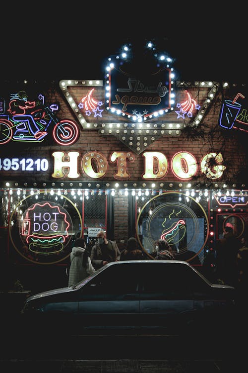 Illuminated Signage in Front of a Building