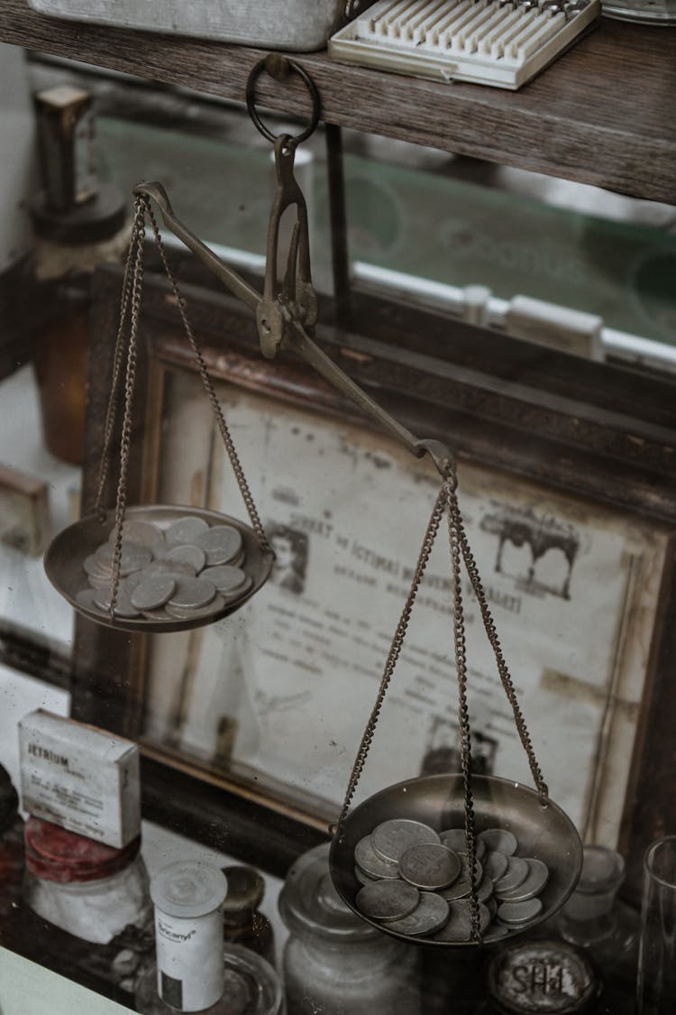 Silver Coins On An Antique Weighing Scale