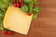 Red Cherry Tomatoes Beside Yellow Cheese