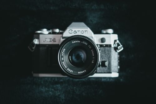 Free Close-up of a vintage Canon analog camera with lens detail. Stock Photo
