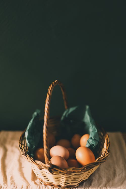 Free Brown Woven Basket With Eggs Stock Photo
