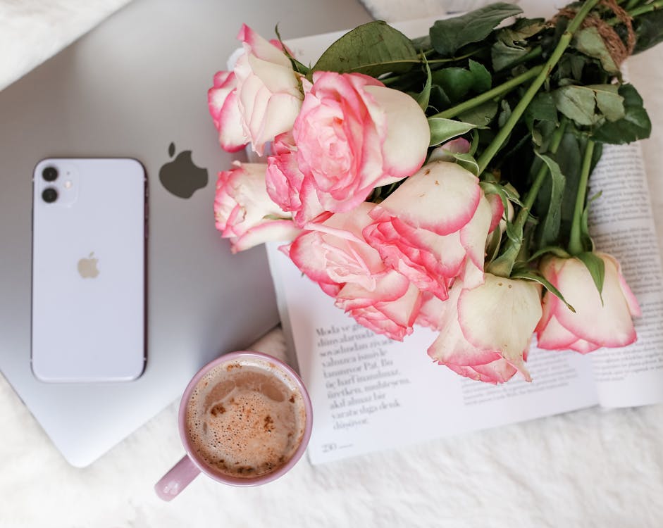 Flatlay Photo of  Gadgets, Bouquet of Roses, and Cup of Coffee