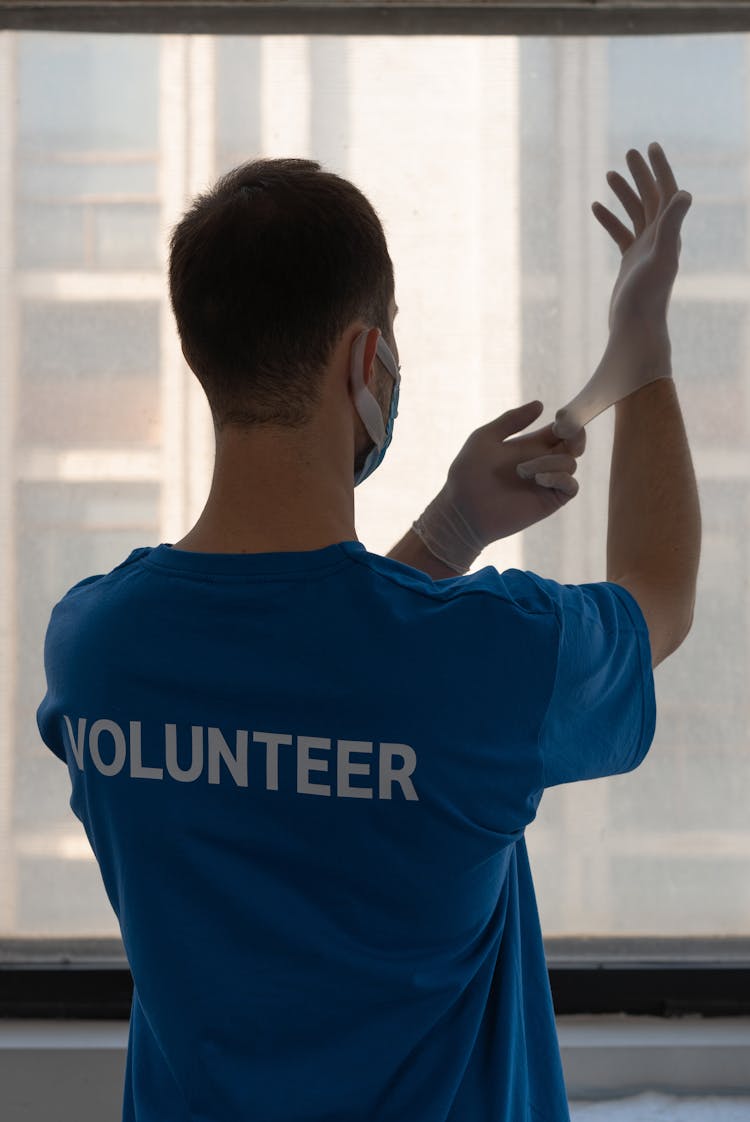 A Man Wearing Surgical Gloves