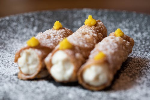 Tube shaped pastry on plate