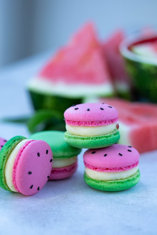 Macaroons near slices of watermelon