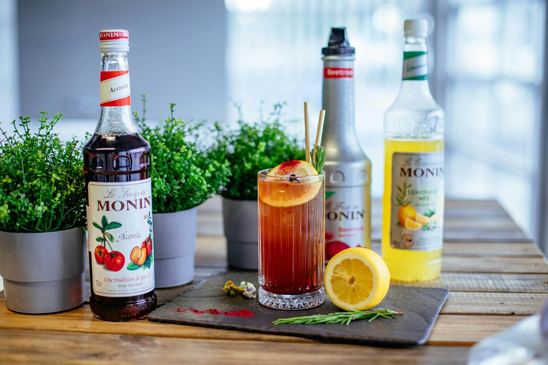 Iced coffee and syrups on table