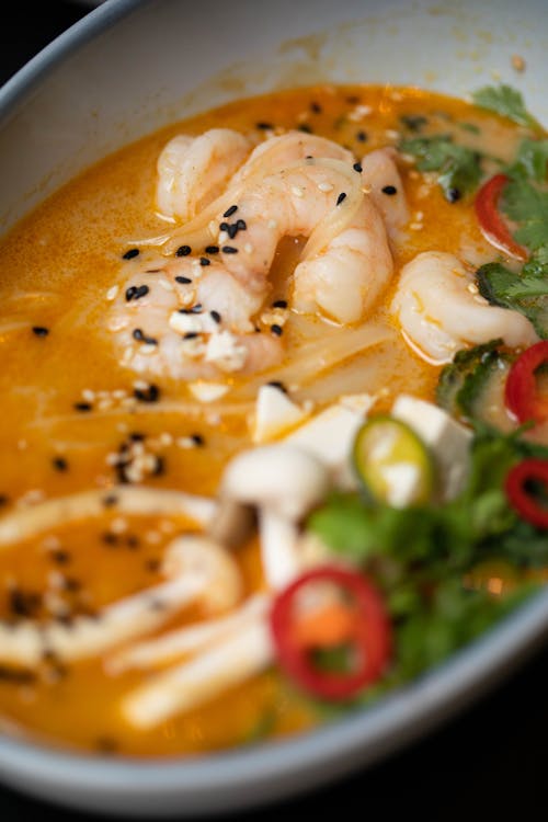 Soup With Sliced Tomato and Green Leaf Vegetable in White Ceramic Bowl