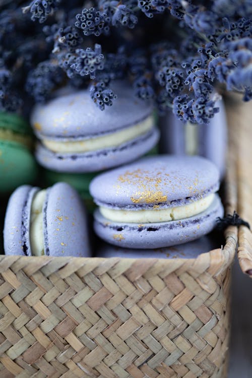 Fresh sweet macaroons in wicker timber basket