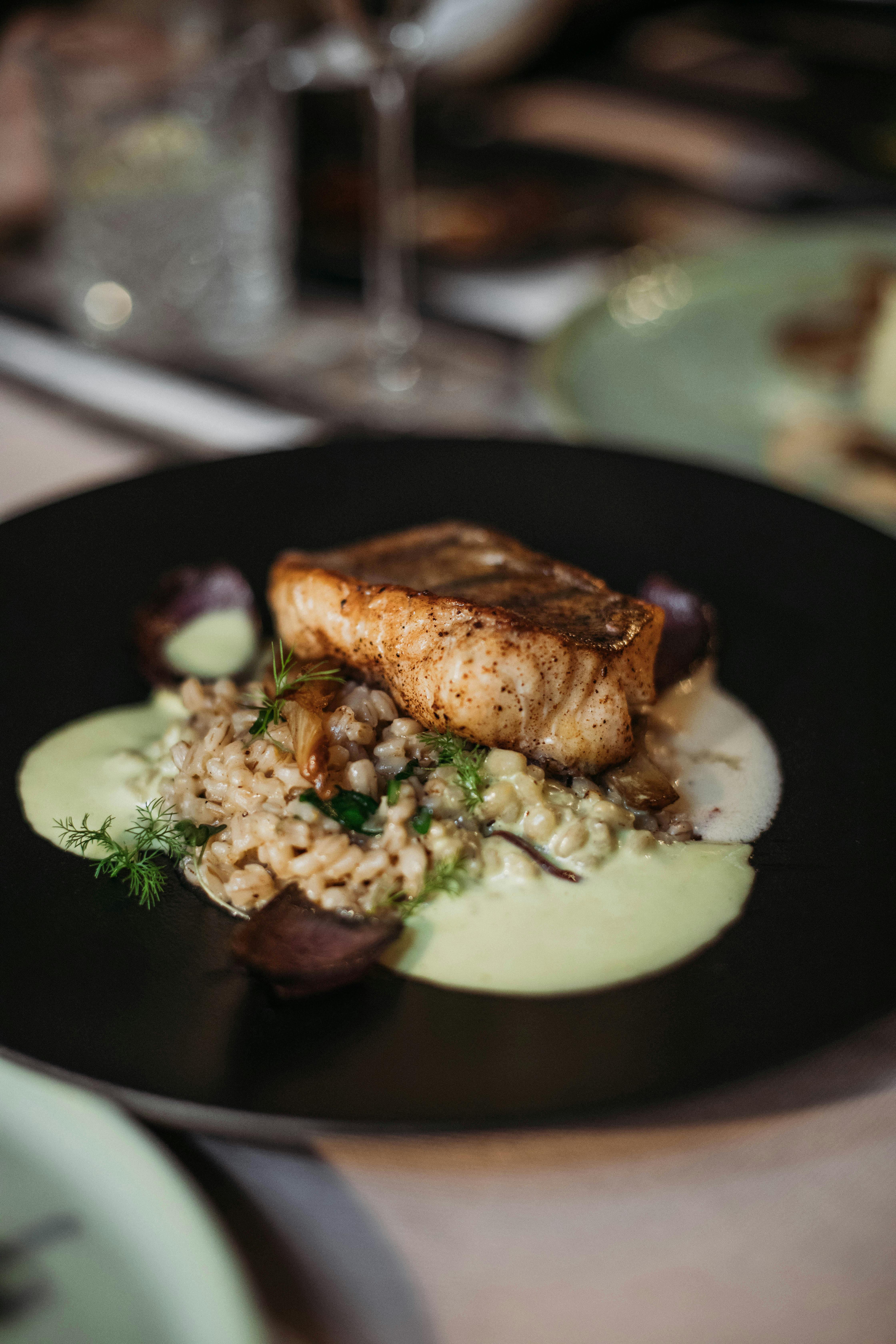 steak of fish served with grains