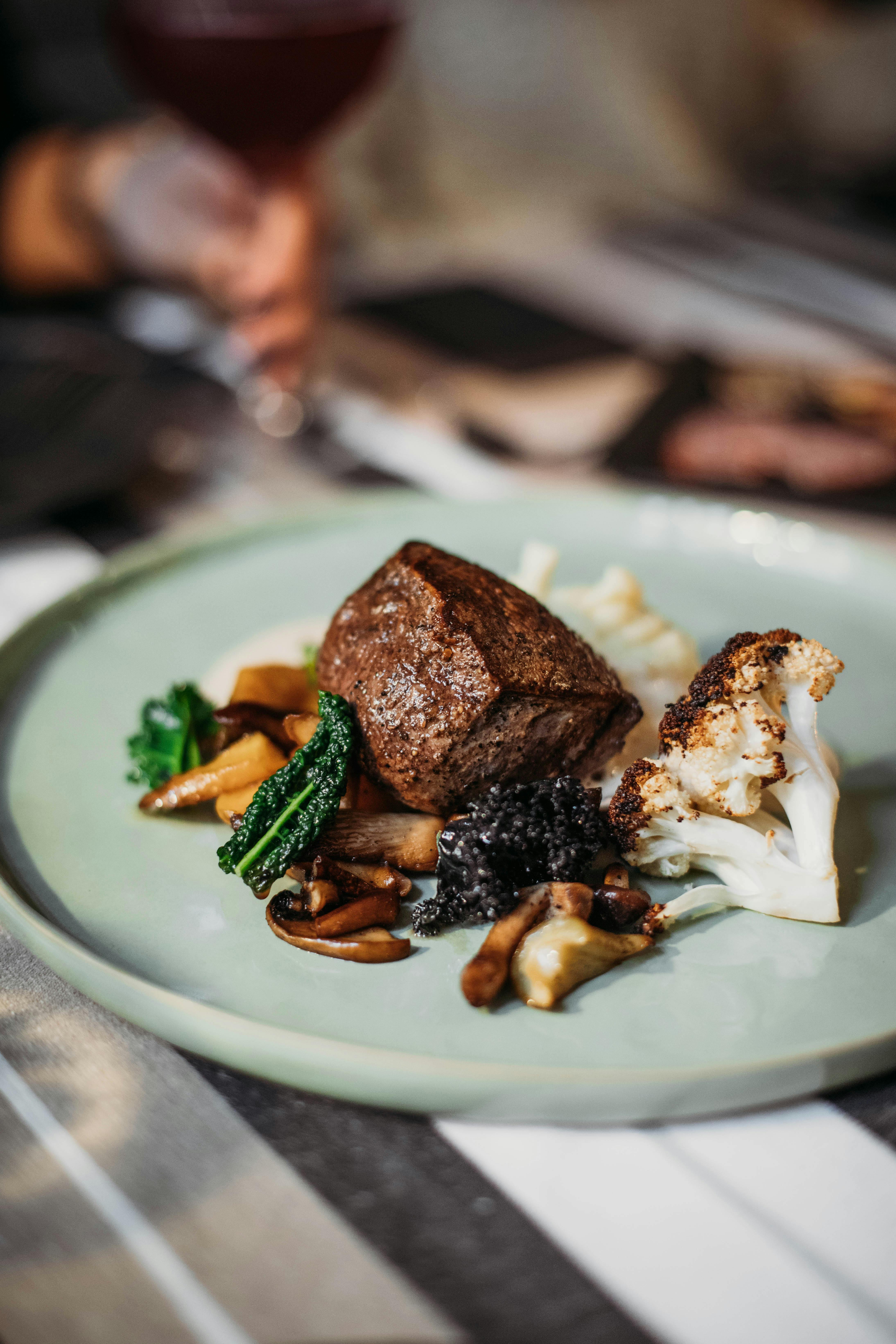 steak served with grilled cauliflower