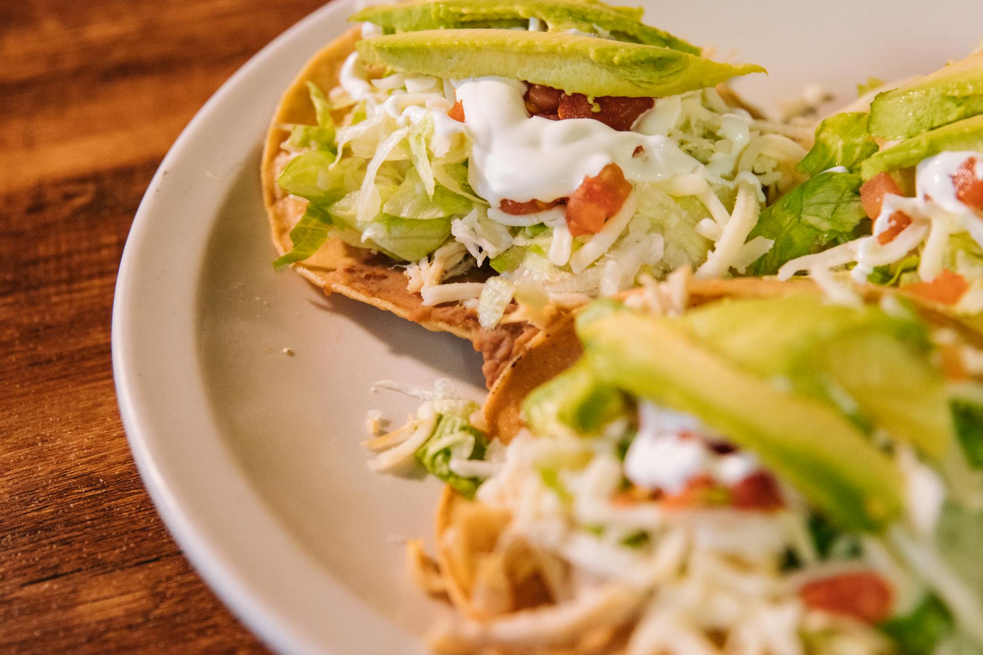 Fresh Tacos with Avocados on White Ceramic Plate