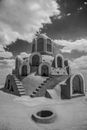 Grayscale Photo of Concrete Building Under Cloudy Sky
