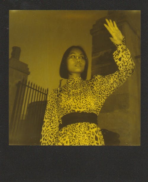 Polaroid Photo of a Woman in Leopard Print Dress