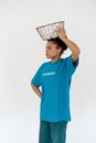 Man in Blue Adidas Crew Neck T-shirt Holding White and Black Checkered Paper