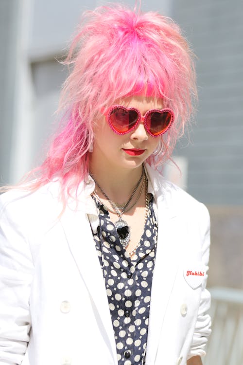 Woman with Pink Hair Wearing White Blazer 