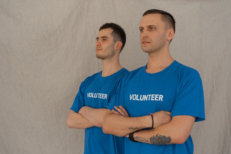 Photo Of Volunteers Crossing Their Arms