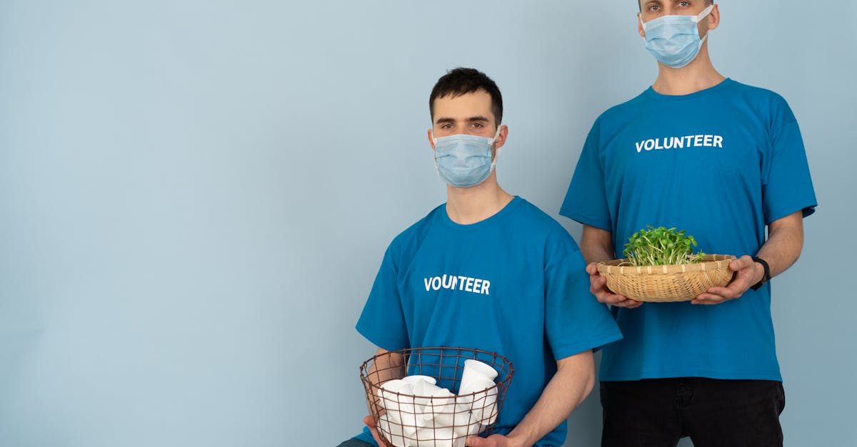 Man in Blue Crew Neck T-shirt Holding Green and White Basket