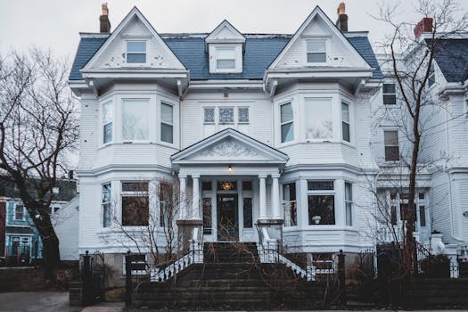 Elegant Victorian-style house showcasing intricate architectural details, ideal for real estate and design inspiration.