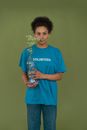 Woman in Blue Crew Neck T-shirt Holding White Flower Bouquet