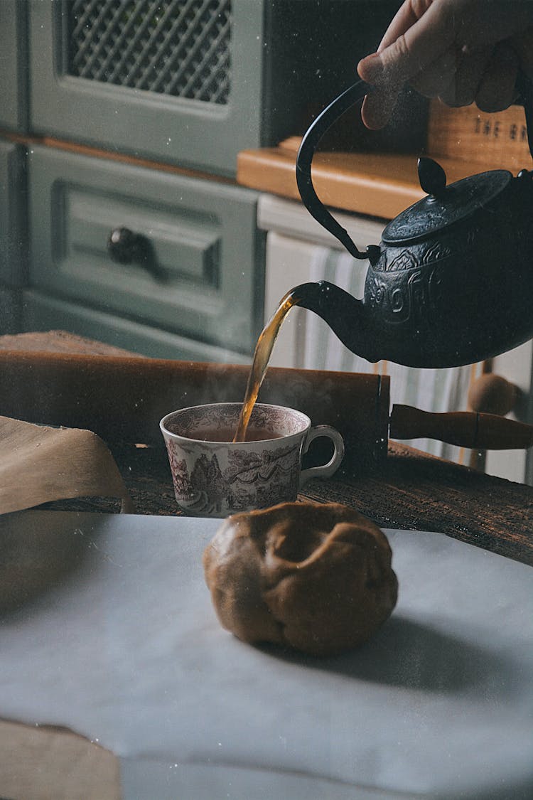 Hand Pouring Tea