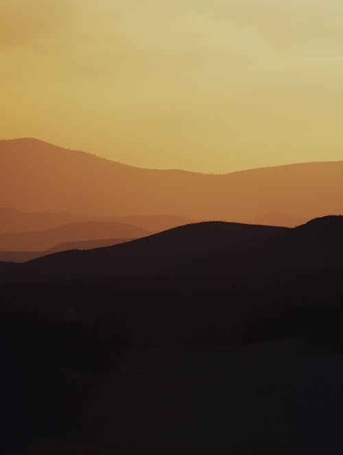 Silhouette of Mountains during Sunset