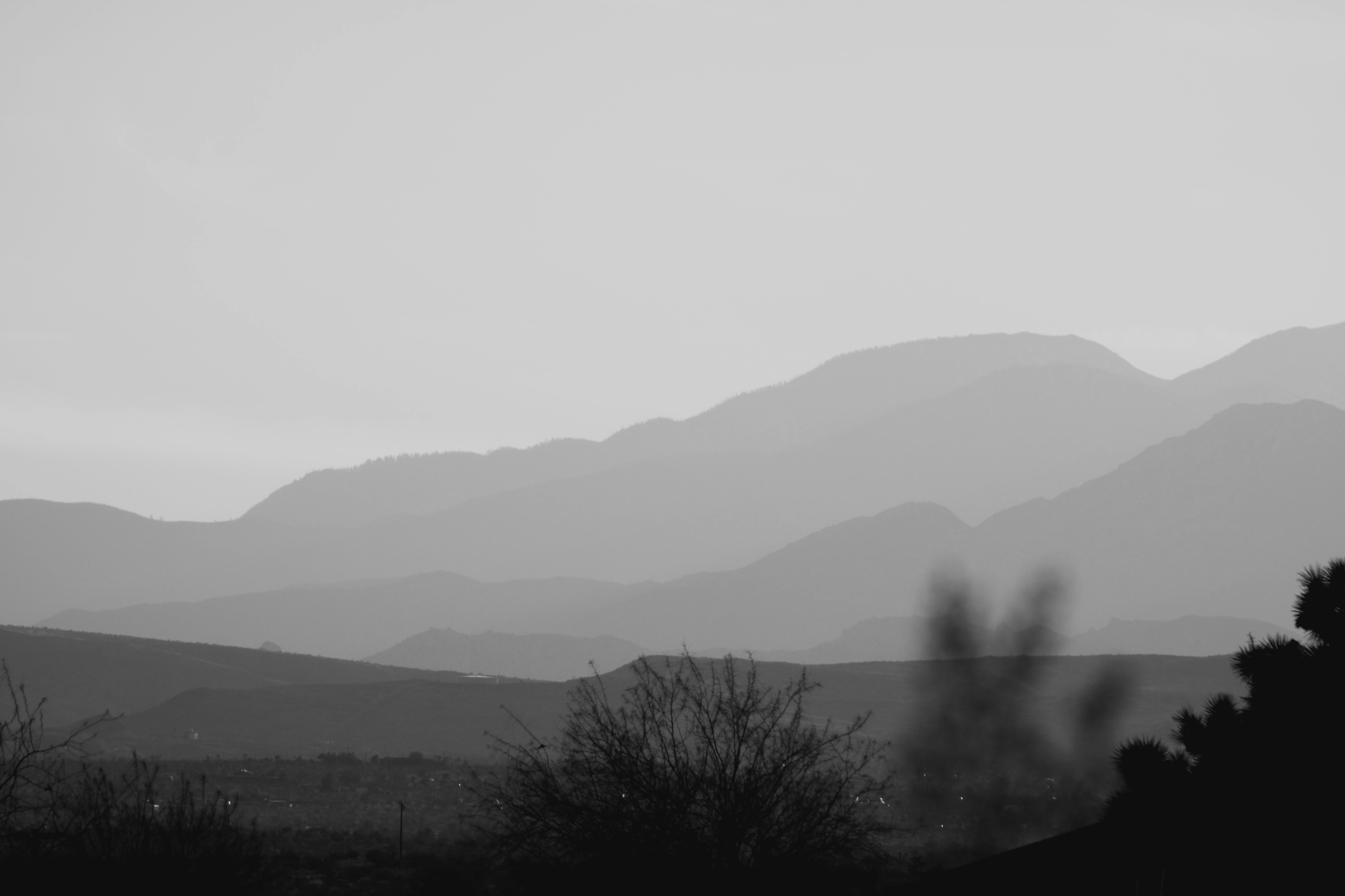 black and white mountain under white sky