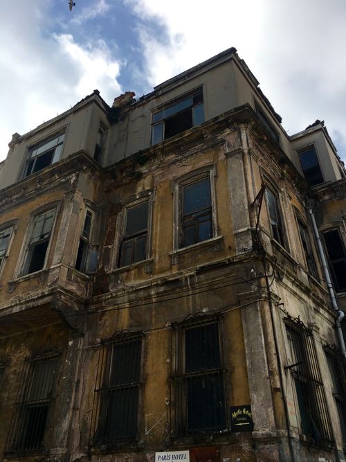 Free A vertical view of a decaying, abandoned building showcasing vintage architecture. Stock Photo