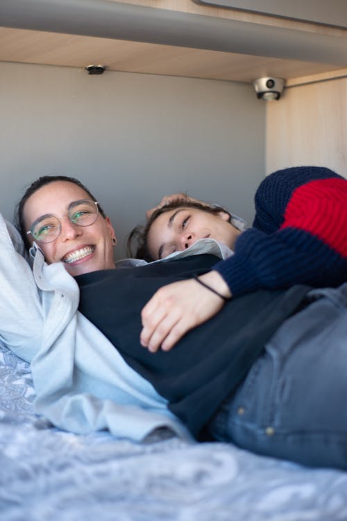 Free A Couple Lying inside the Caravan Stock Photo