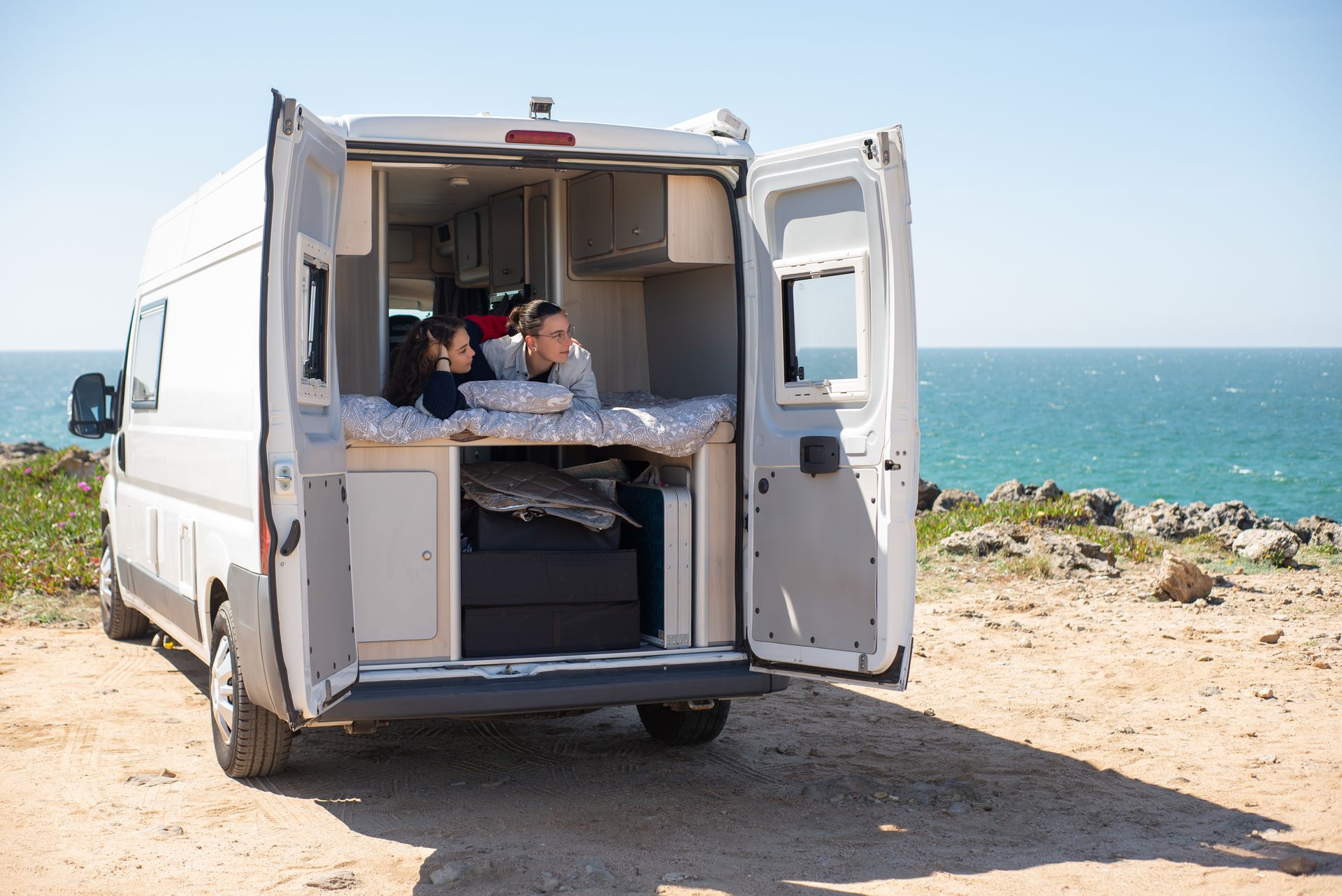 A Couple Lying Together in a Bed Inside a Motorhome