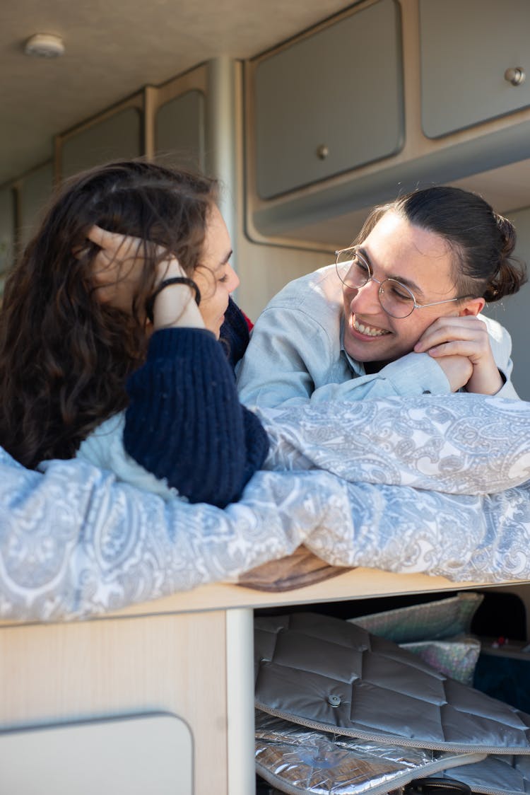 A Couple Lying Together In A Bed Inside A Motorhome