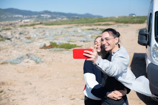 Happy couple taking a selfie with a scenic backdrop of Portugal. Perfect for travel and lifestyle themes.