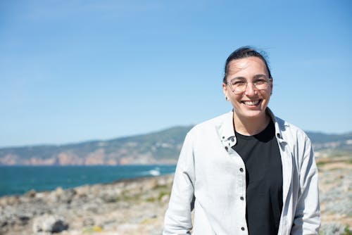 Smiling Woman Under Blue Sky 