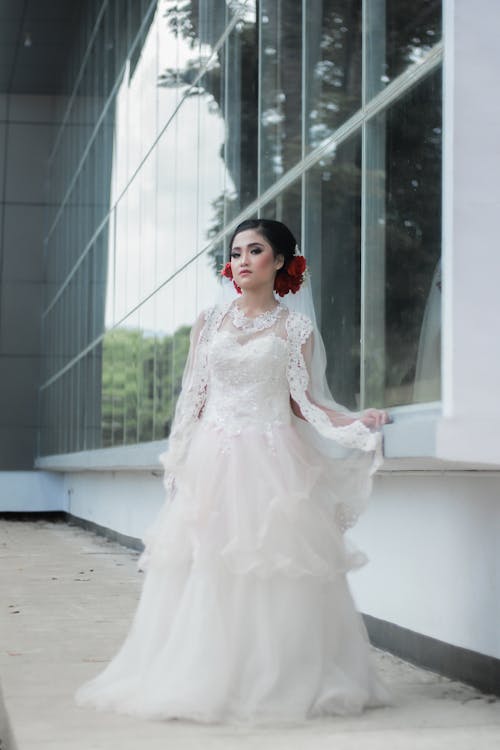 A Pretty Woman in White Wedding Dress Looking at Camera