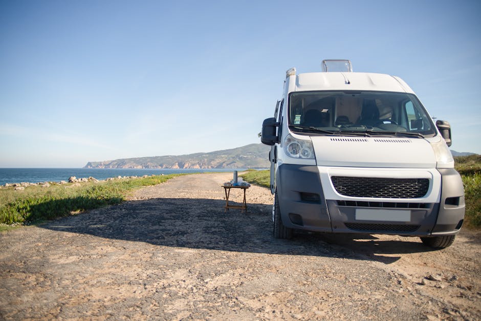 riviera maya hidden gems off the beaten path - Camper van parked on a coastal road with ocean view in Portugal, perfect for summer travel.