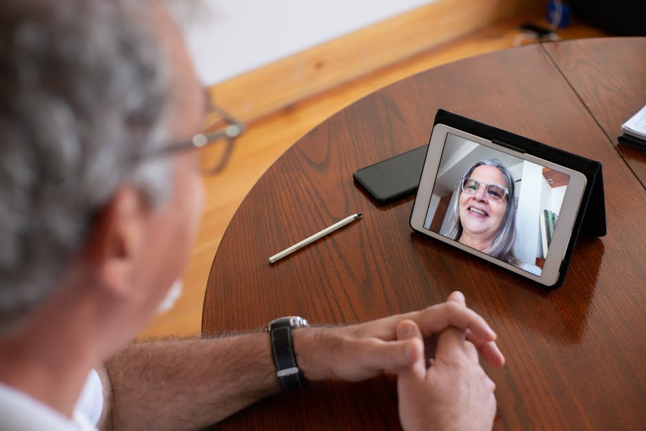 elderly person on a video call with family on a tablet - Dementia activities at home elderly person on a video call with family on a tablet - Dementia activities at home