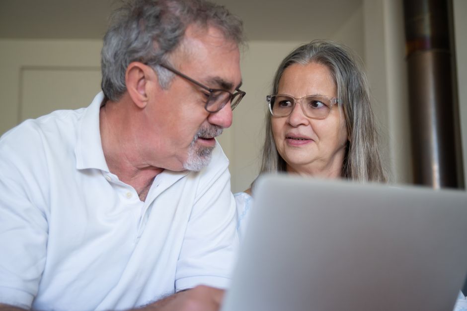 Family discussing senior care options and financial planning Family discussing senior care options and financial planning