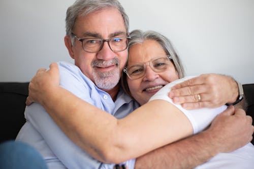 Free An Elderly Couple Hugging Each Other Stock Photo
